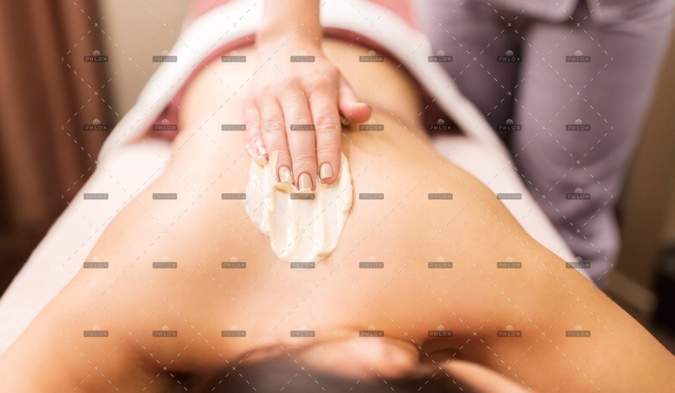 demo-attachment-386-woman-having-back-massage-with-cream-at-spa-PFCWZ34